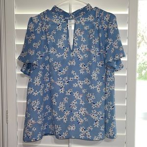 This is a Sienna Sky blouse and it is a medium it is a sky  blue color!